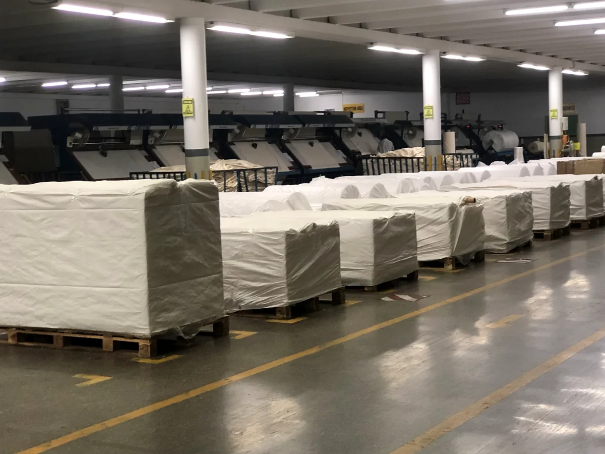 Packed greige fabric prepared for shipment at a selected supplier mill